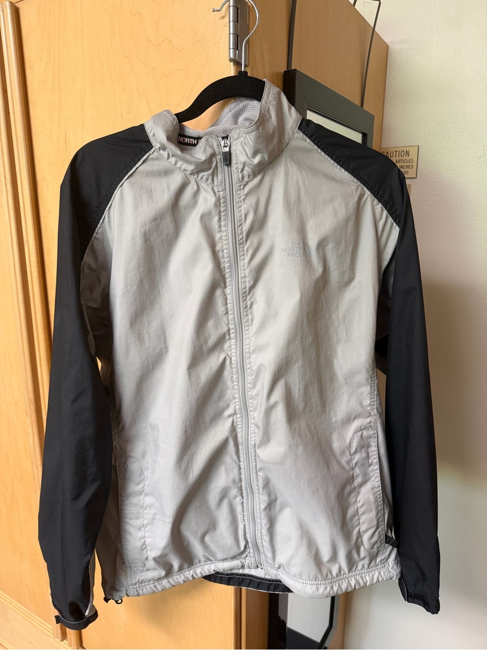 The North Face Light Gray and Black Kids' Windbreaker Jacket
